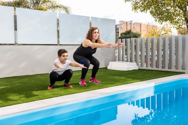 Mother Son Doing Exercise Home Garden — Stock Photo, Image