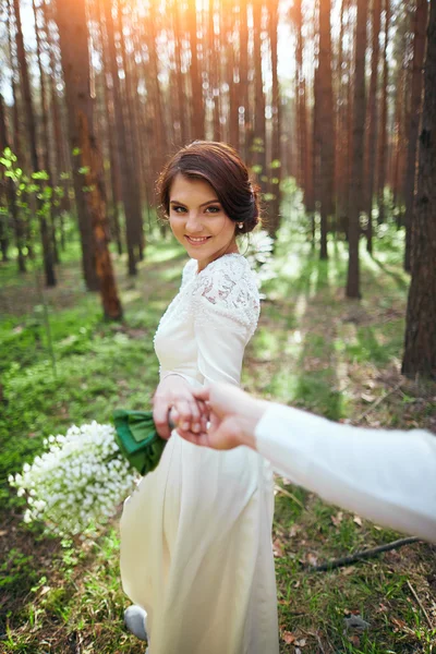 Wedding photosession of young couple near forest — Stock Photo, Image