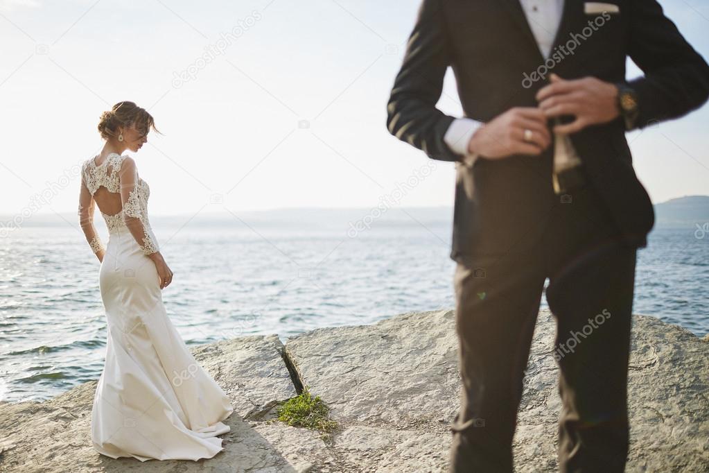 photoshoot lovers in a wedding dress in the mountains near the s