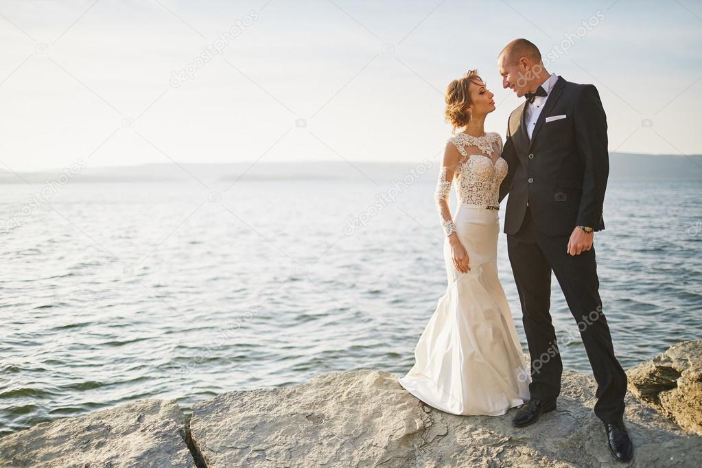 photoshoot lovers in a wedding dress in the mountains near the s