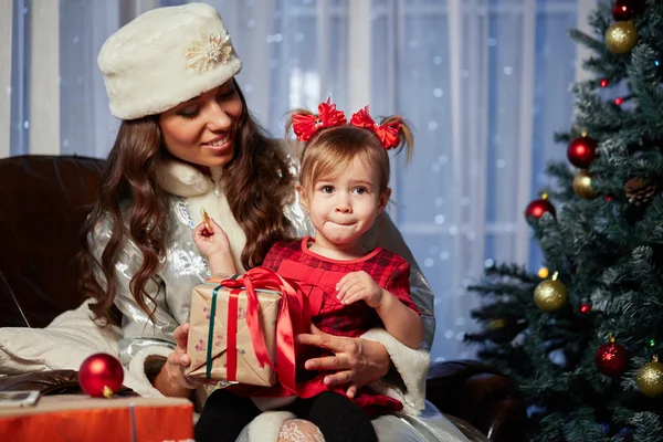 Santa Claus gives presents at the celebration Christmas