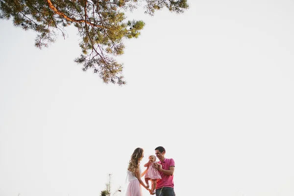 Beautiful family of three people, mom dad and daughter — Stock Photo, Image