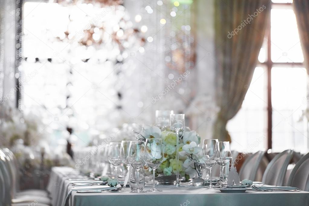 Wedding reception with floral arrangement of white orchids