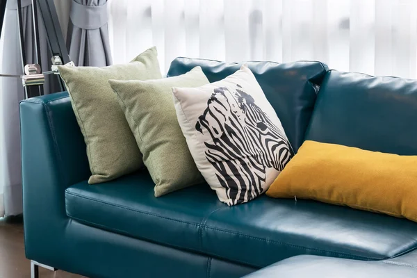 modern living room with green sofa and pillows at home