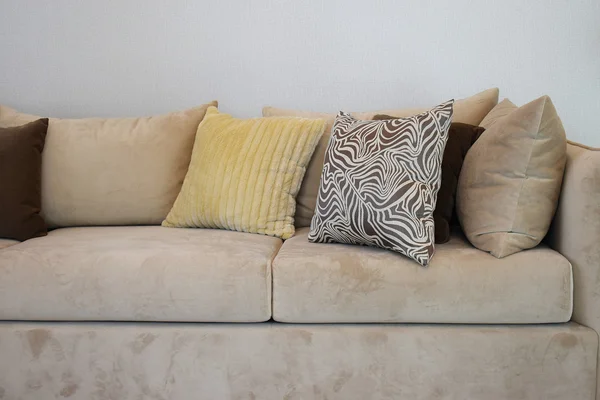 Sturdy brown tweed sofa with grey patterned pillows — Stock Photo, Image