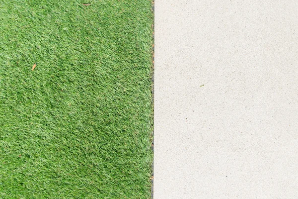 Grind textuur en strook gras als achtergrond — Stockfoto
