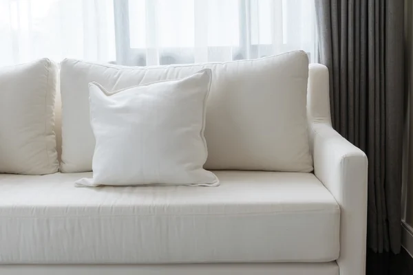 White decorative pillows on a casual sofa in the living room — Stock Photo, Image