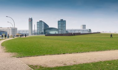 Berlin Hauptbahnhof or Berlin Central Station with green field