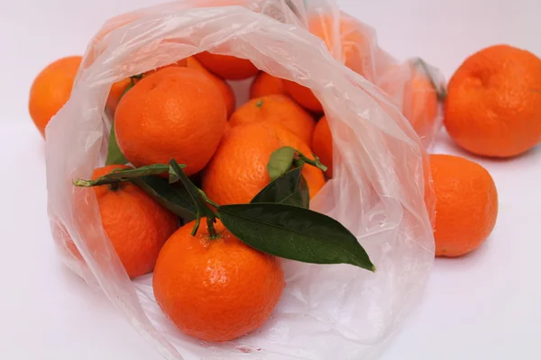 Tangerines. in a transparent bag — Stock Photo, Image