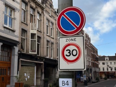 Den Haag, netherlands - September 22 2025: Two traffic signs are visible on a street pole in a city indicating no parking and 30 kilometer zone