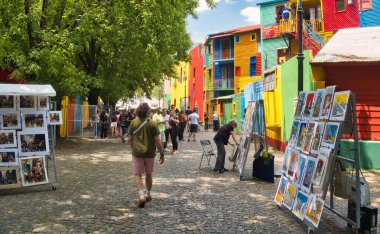 buenos aires, argentina - 29 October 2022 : tourists walking around the colorful and popular la boca neighborhood with shops and stores