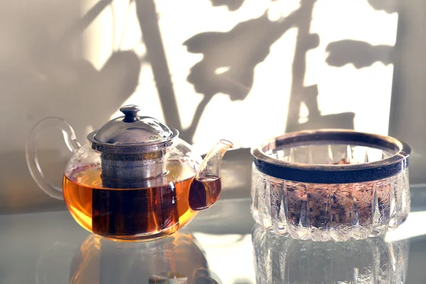 Glass teapot standing on a glass table. — Stock Photo, Image