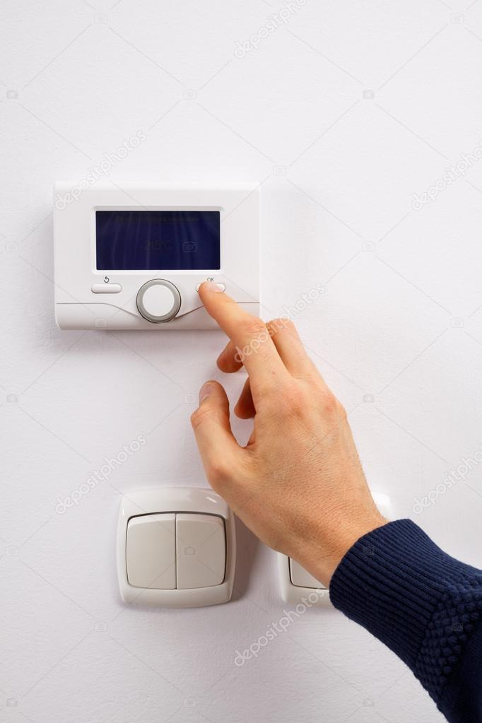 Hand regulate temperature on control panel.