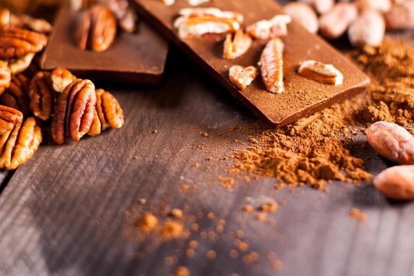 Chocolate products and nuts — Stock Photo, Image