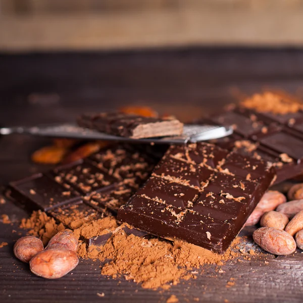 Chocolate products and nuts — Stock Photo, Image