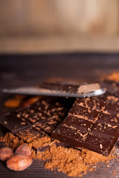 Chocolate products and nuts — Stock Photo, Image