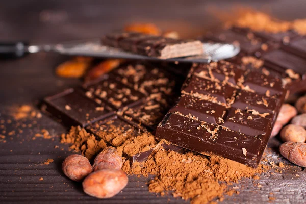 Chocolate products and nuts — Stock Photo, Image