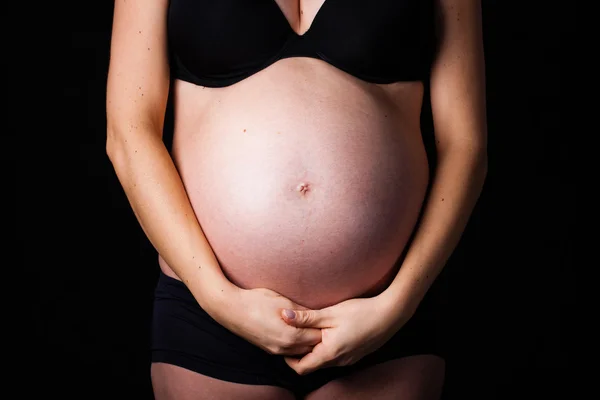 Pregnancy belly with hand. — Stock Photo, Image