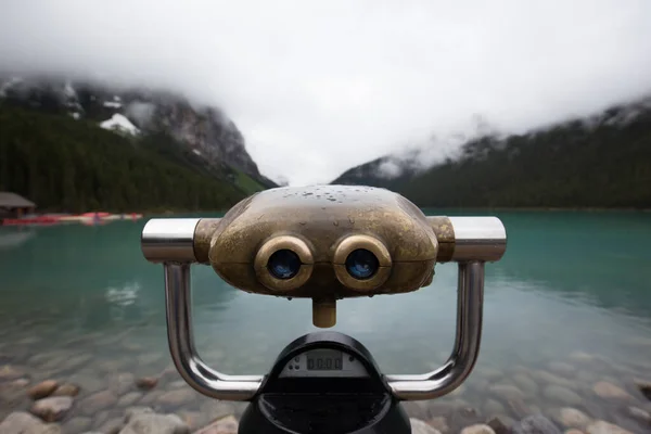 Vintage googles on the shore of the Louise lake. Focused on the googles.