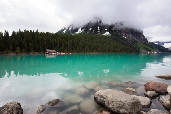 Louise Lake shore by a stormy and rainy day