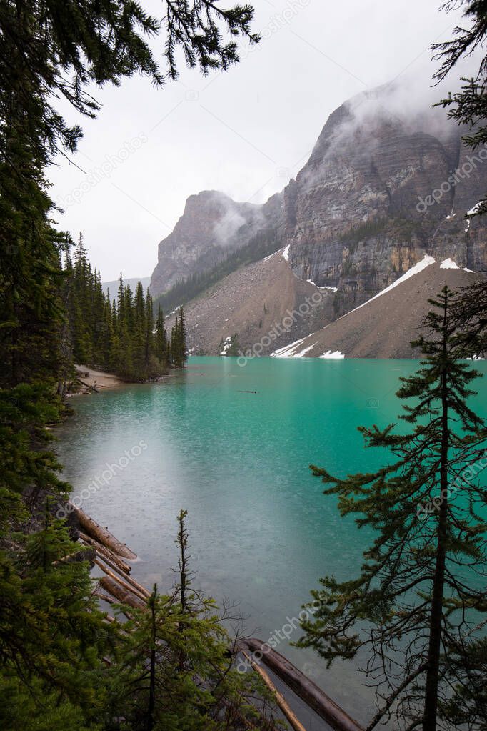 Moraine lake on a rainy and misty day. Alberta, Canada.