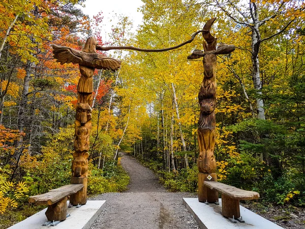 2 totems in the forest in Quebec