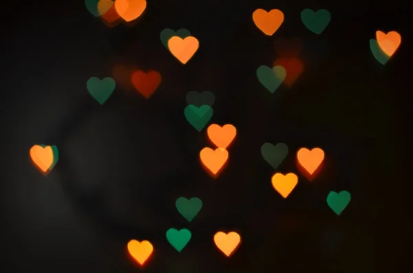 Hintergrund mit farbigem Bokeh. Hintergrund zum Valentinstag — Stockfoto