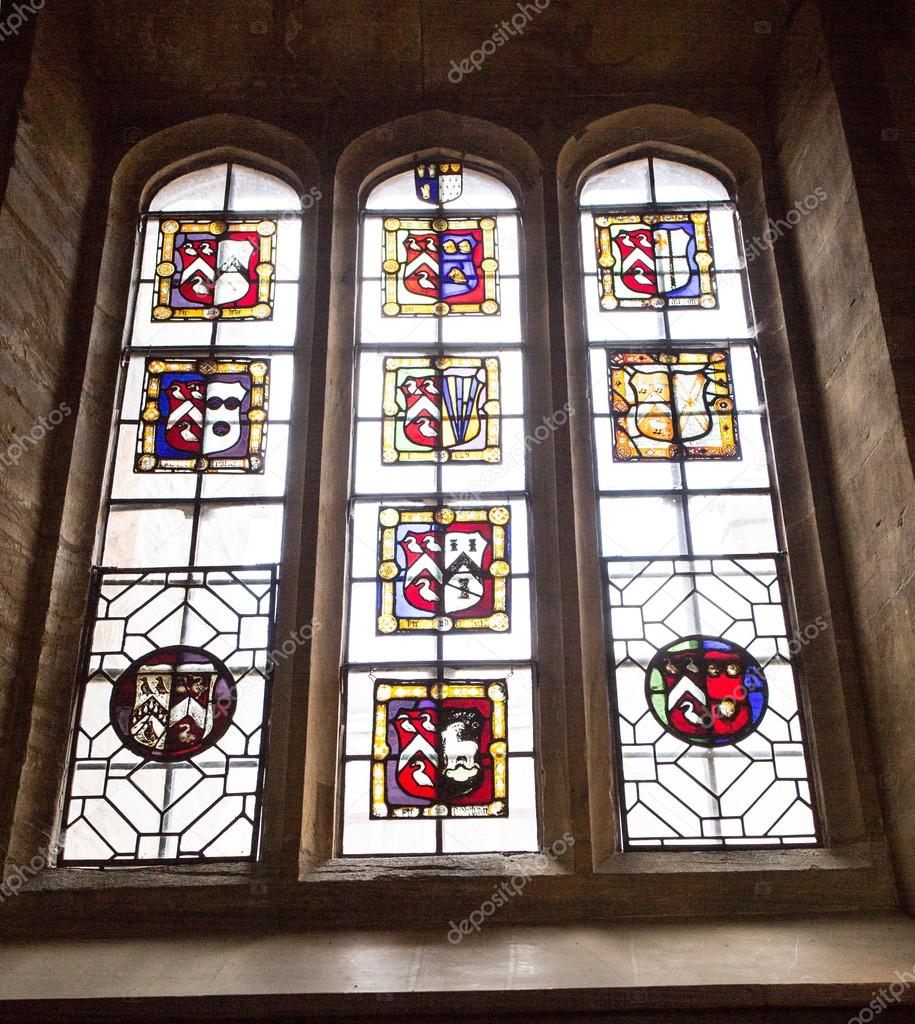 Stained glass window in great hall of manor house. Stock Editorial
