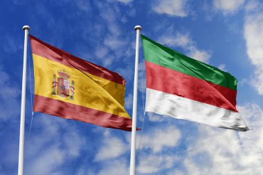 Mavi gökyüzünde sallanan İspanya ve Heligoland bayrakları diplomasiyi, ticareti, stratejik ortaklığı ve birliği simgeliyor.