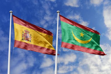 Mavi gökyüzünde dalgalanan İspanya ve Moritanya bayrakları diplomasiyi, ticareti, stratejik ortaklığı ve birliği simgeliyor.