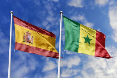Mavi gökyüzünde dalgalanan İspanya ve Senegal bayrakları diplomasiyi, ticareti, stratejik ortaklığı ve birliği simgeliyor.