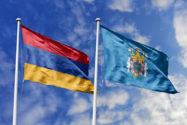 Ulusal Ermenistan ve Melilla bayrakları mavi gökyüzüne karşı el sallayarak uluslararası diplomasiyi, ikili ticari ilişkileri, stratejik ortaklığı ve ülkeler arasındaki kültürel alışverişi simgeliyor..