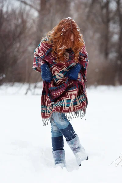 Young red-haired woman in the winter forest — Stock Photo, Image