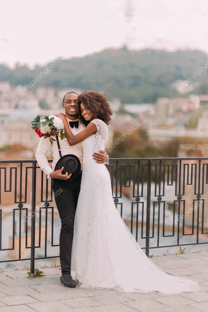 Premium Photo | Full length portrait of a happy smiling african couple  standing and showing ok gesture.