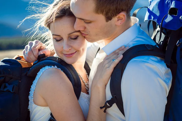 Portrait of young happy tourist wedding couple in Alps close up — 图库照片