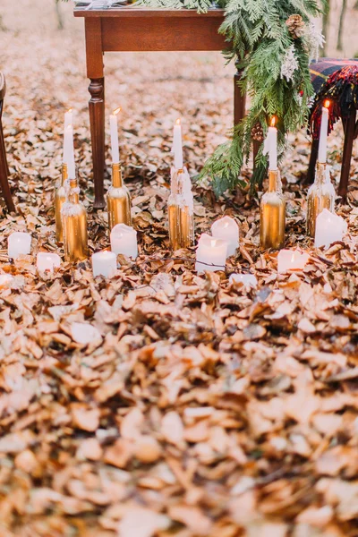 Vintage table with cake and candles in the autumn forest — Stock Photo, Image