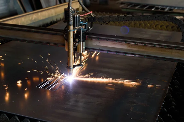 Metal grinding with bright orange flying sparks