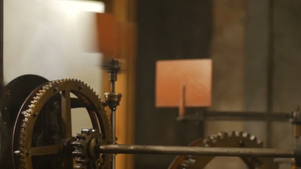 Close up detail view of complicated internal clock mechanism with gearwheels and moving links — Stock Video