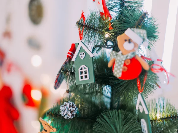 Creative cute  Christmas tree toys hanging on the branches close up — Stock Photo, Image