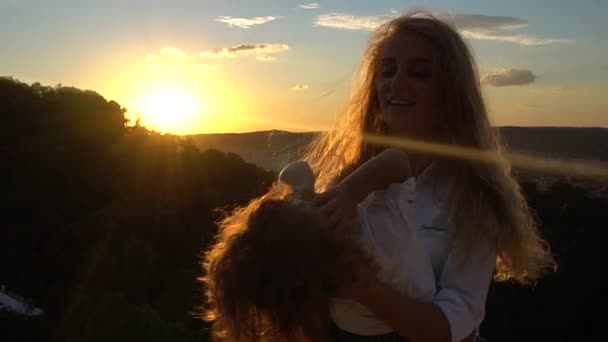 Joyful mother turns in the arms of her baby. Child fun laughing in the arms of his mother. — Stock Video