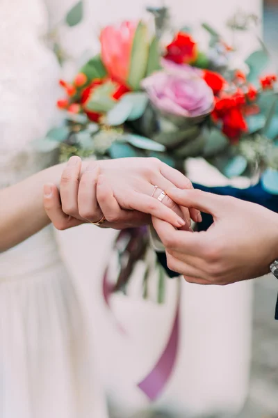 Marry me. Groom put a ring on finger of his lovely wife. Wedding couple together — Stock Photo, Image