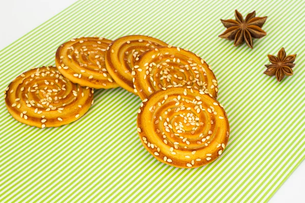 Round cookies with sesame seeds and star anise