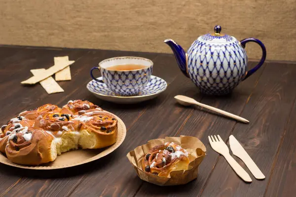 Raisin Buns Cardboard Plate Teapot Cup Tea Dark Wooden Background — Stock Photo, Image