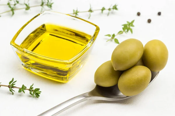 Green Olives Metal Spoon Olive Oil Glass Jar White Background — Stock Photo, Image