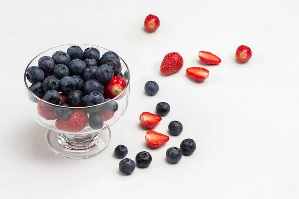 Blueberries Glass Bowl Strawberries Blueberries Table Gray Background Top View — Foto de Stock