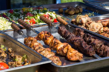 Fried meat on skewer. Street food