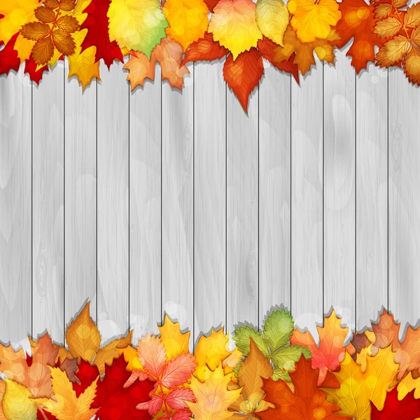 Барвисті листя на дерев'яному фоні — стоковий вектор