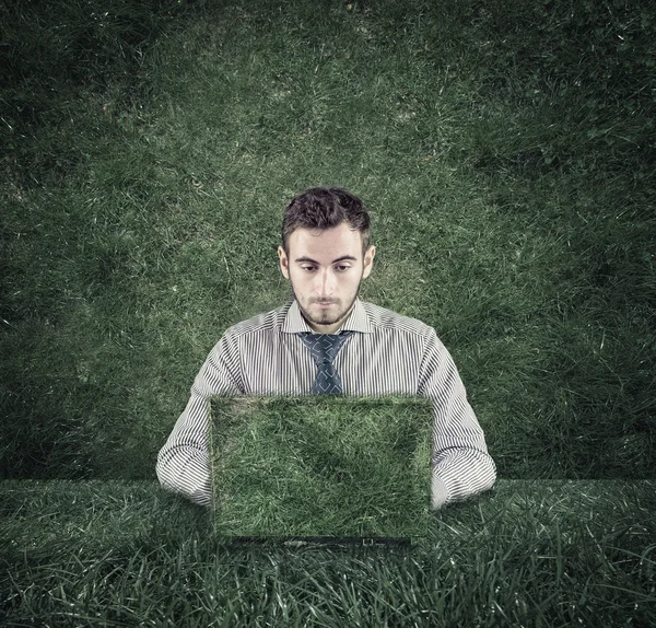 Young man and laptop — Stock Photo, Image