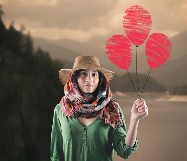 Jonge vrouw met rode ballonnen. — Stockfoto