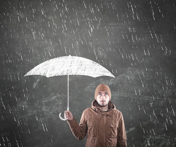 Mladý muž pod deštník — Stock fotografie